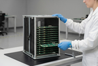 Operator loading boards into a B0106GC belt-adjustment ESD rack